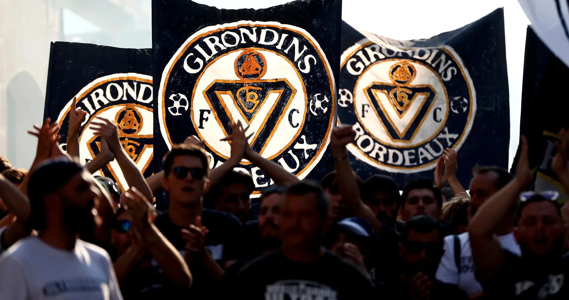 Girondins de Bordeaux fans holding banners during event Girondins de Bordeaux fans holding banners during event