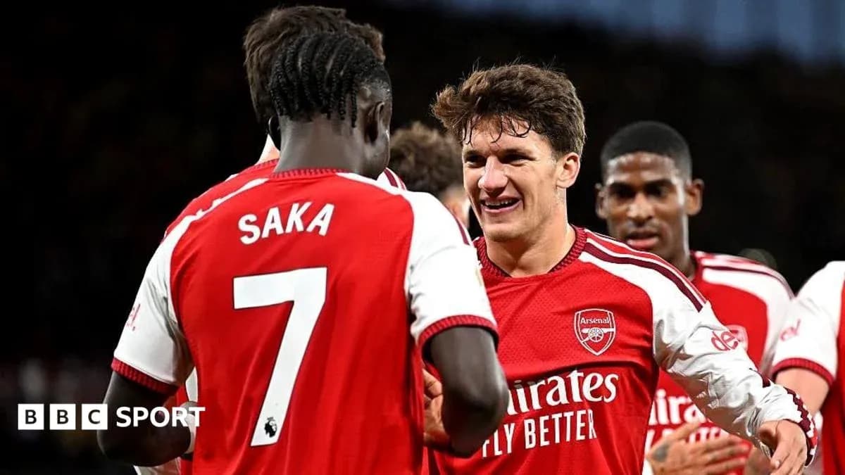 Arsenal players celebrating a goal together Arsenal players celebrating a goal together