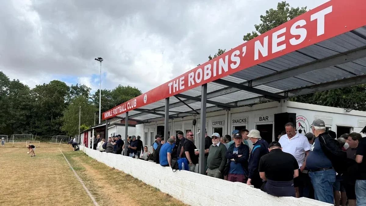 Fans gathered outside Knowle Football Club's stand Fans gathered outside Knowle Football Club's stand