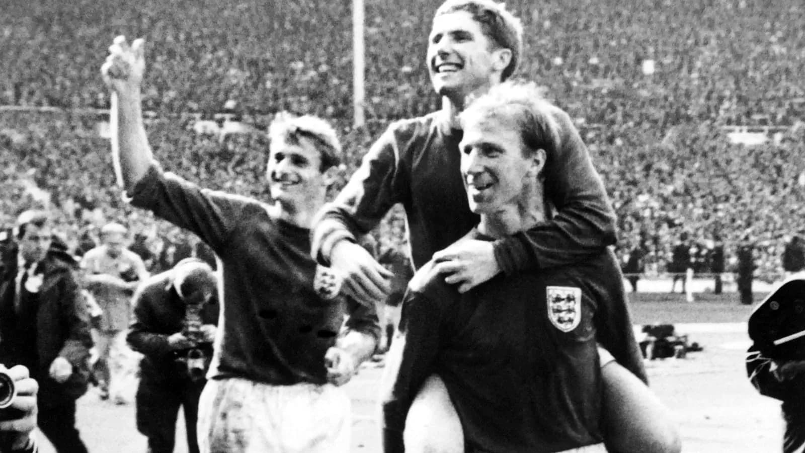 Three England players celebrating a victory together Three England players celebrating a victory together