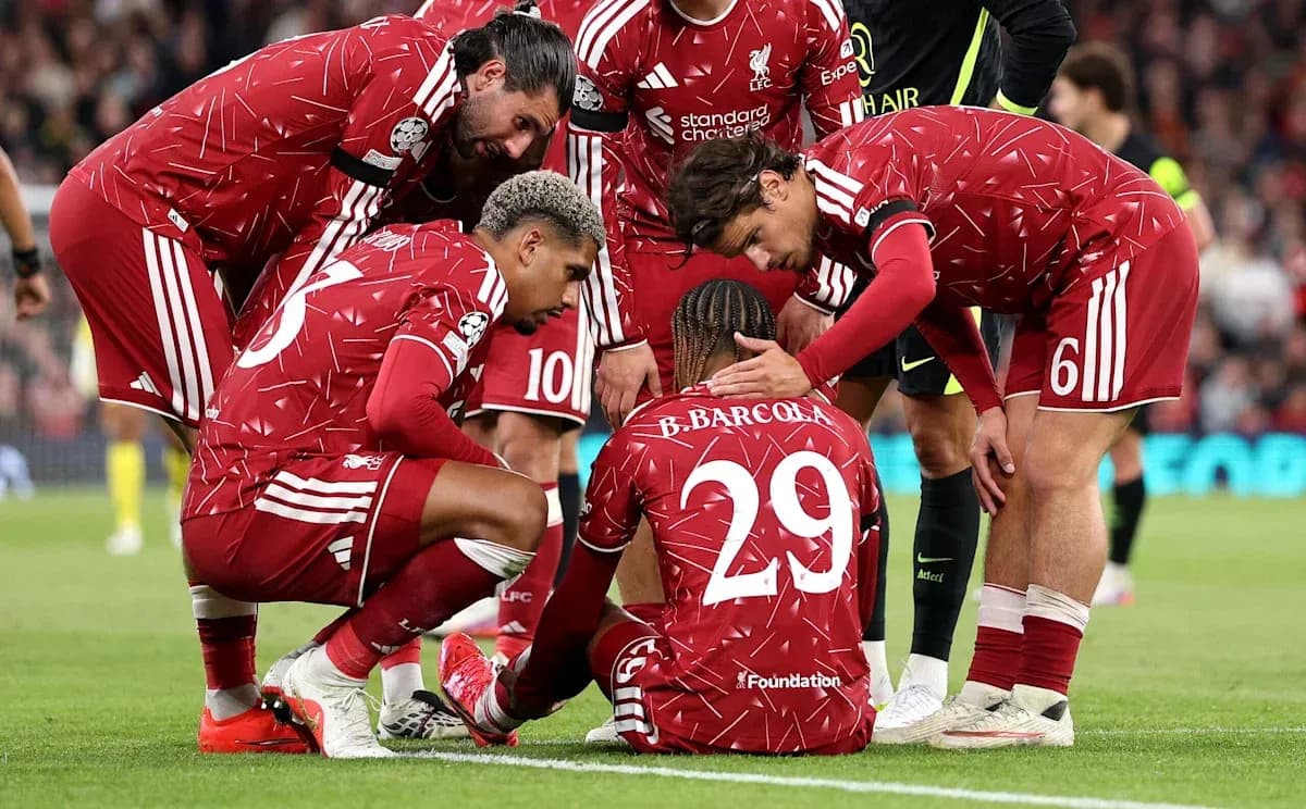 Liverpool players gathered around injured teammate on pitch Liverpool players gathered around injured teammate on pitch