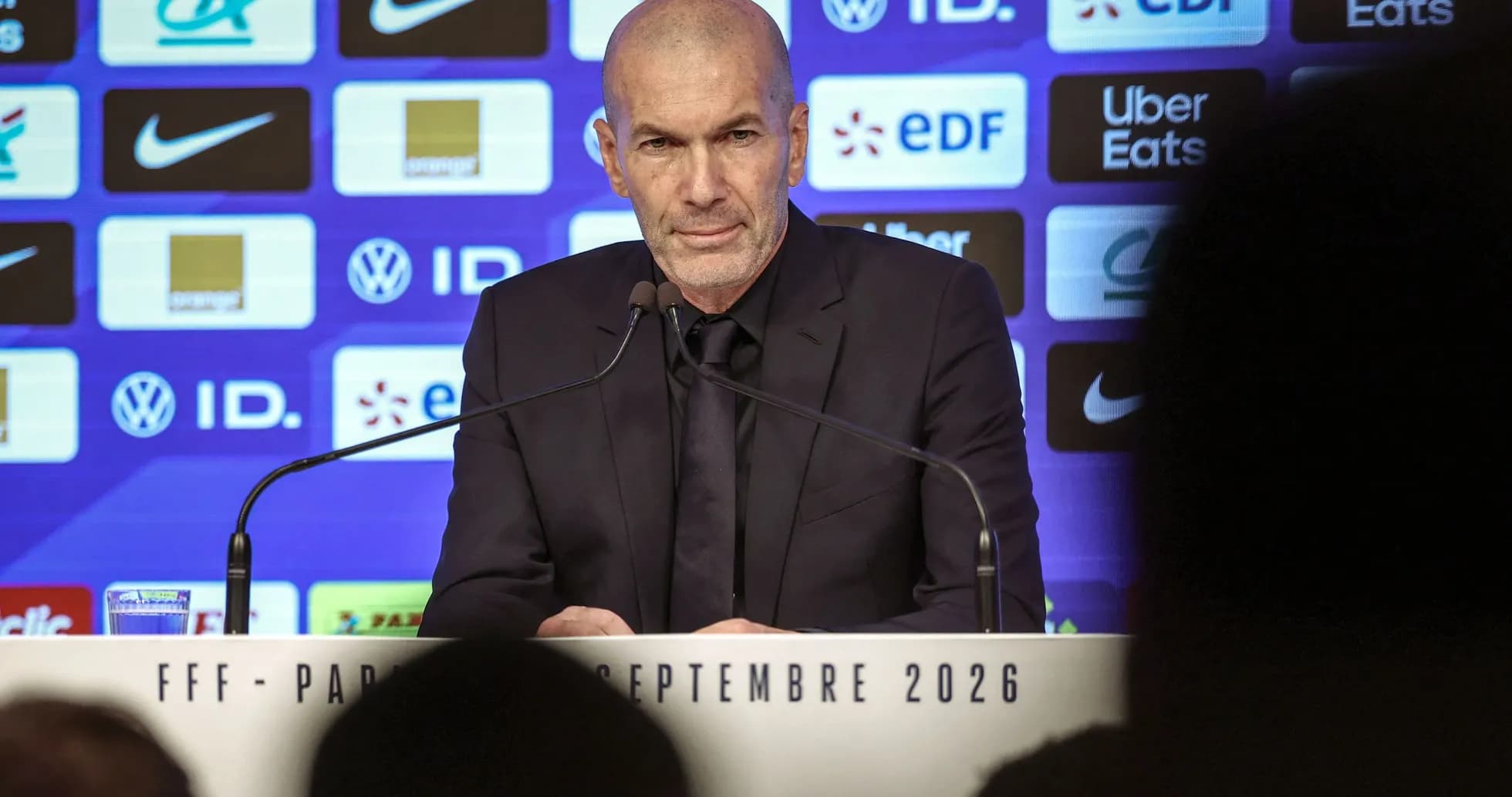 Zinedine Zidane at press conference podium Zinedine Zidane at press conference podium