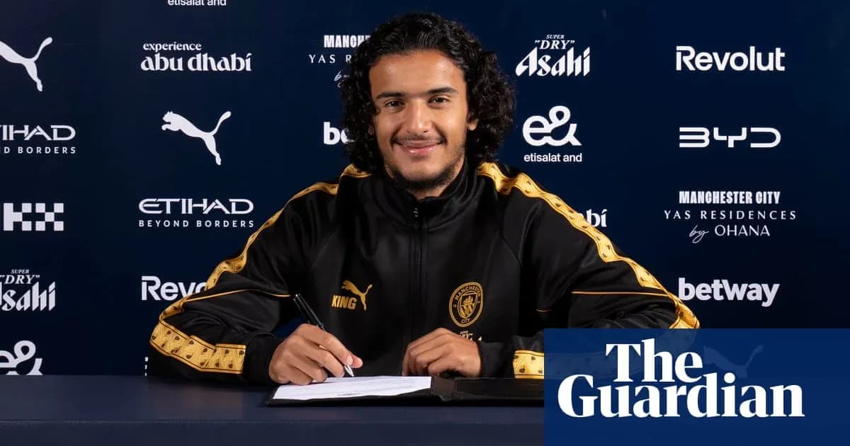 Yoshinori Muto signing contract at Manchester City Yoshinori Muto signing contract at Manchester City