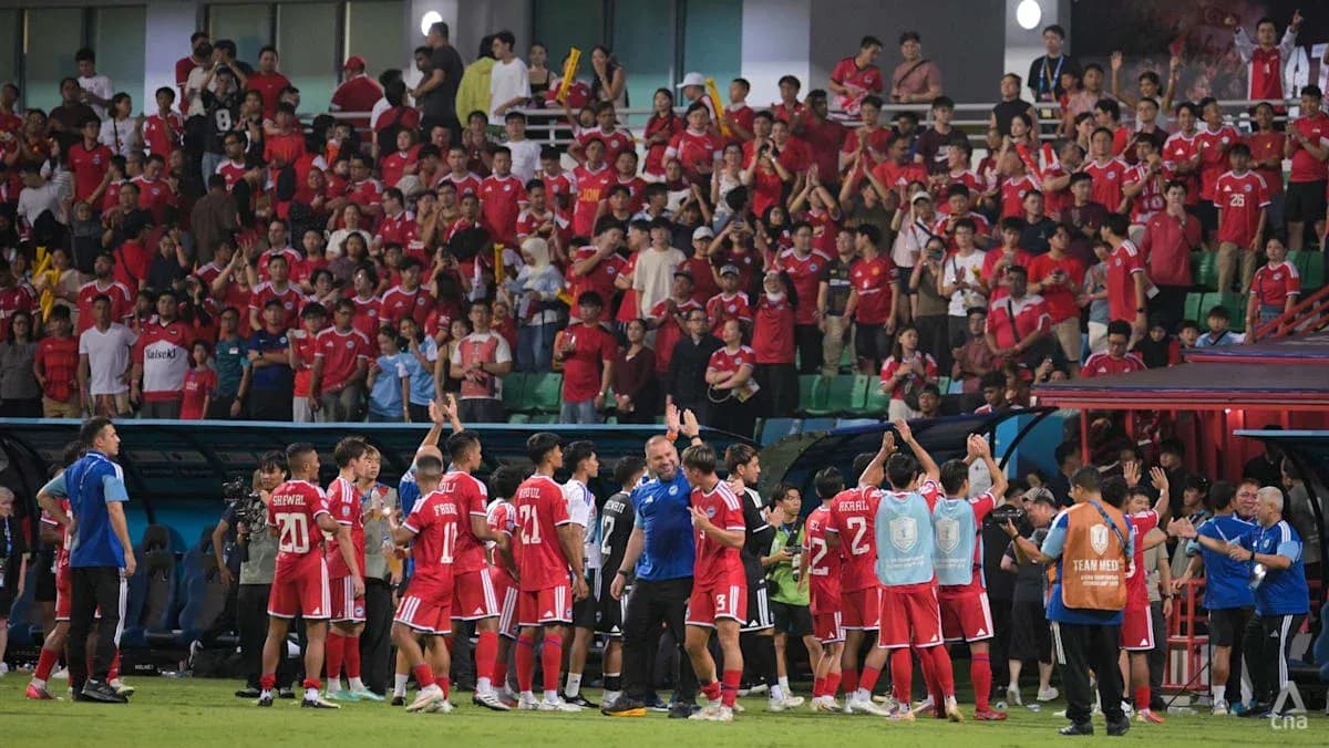 Football team celebrating with fans after match Football team celebrating with fans after match
