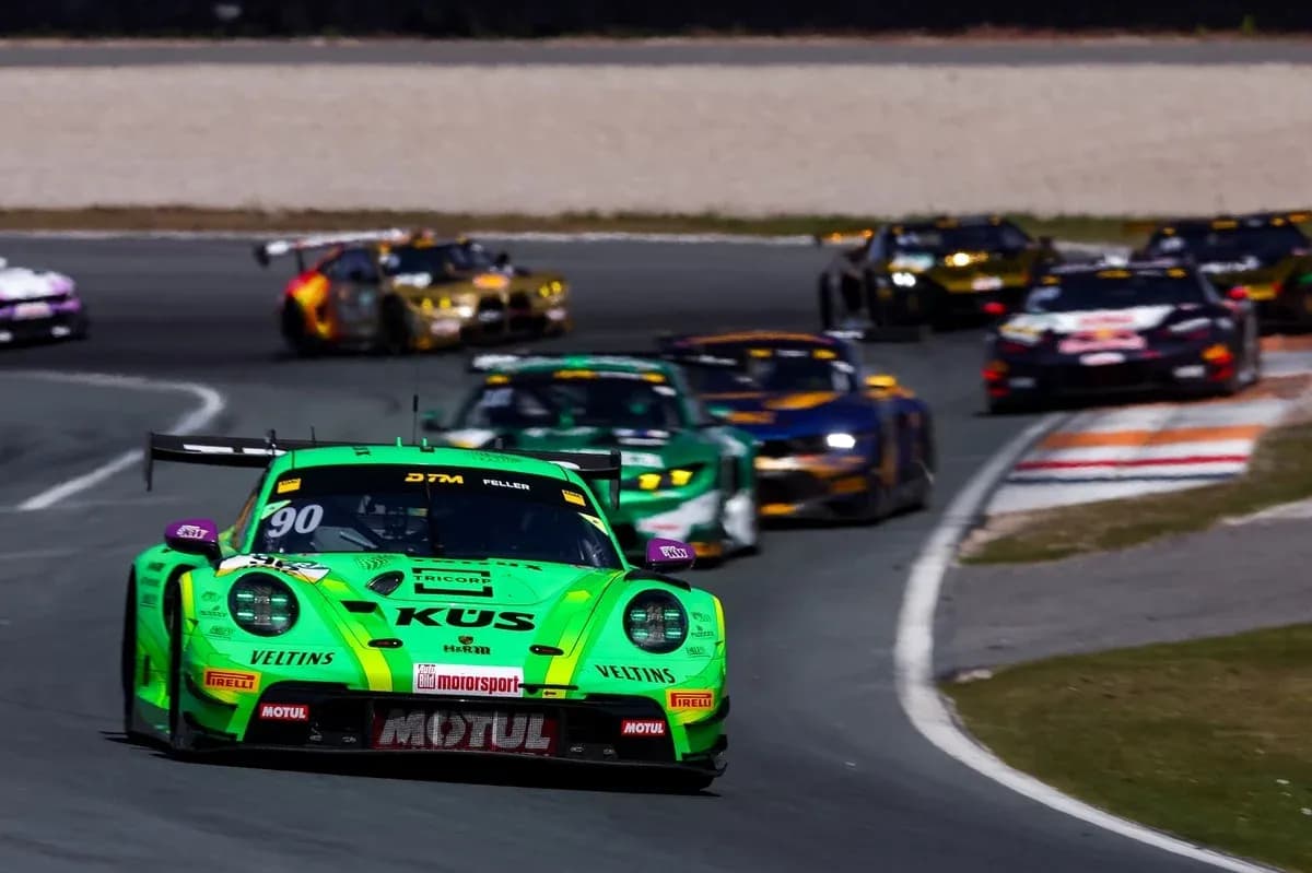 Green racing car leading a pack on track Green racing car leading a pack on track