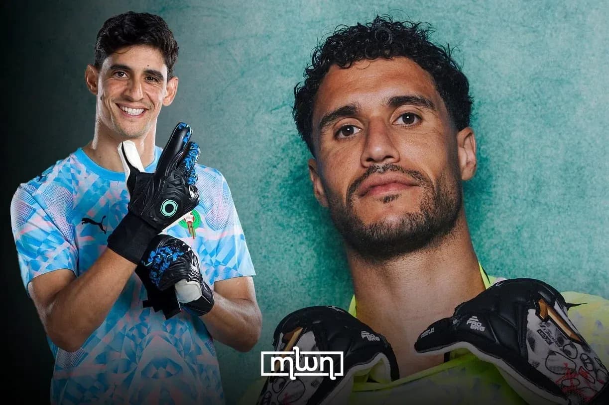 Two goalkeepers posing with gloves in studio Two goalkeepers posing with gloves in studio