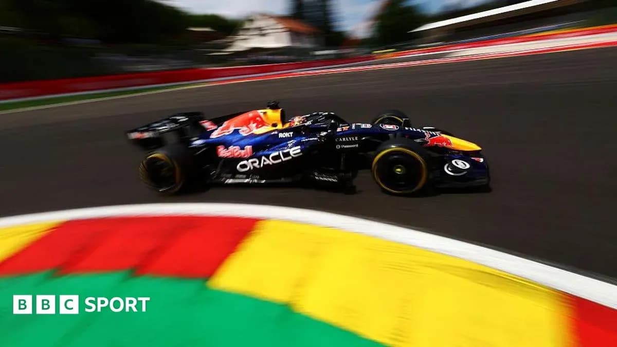 Formula 1 car racing around a colorful track Formula 1 car racing around a colorful track