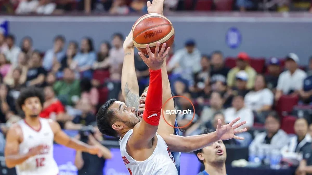 Player shooting basketball during a game Player shooting basketball during a game