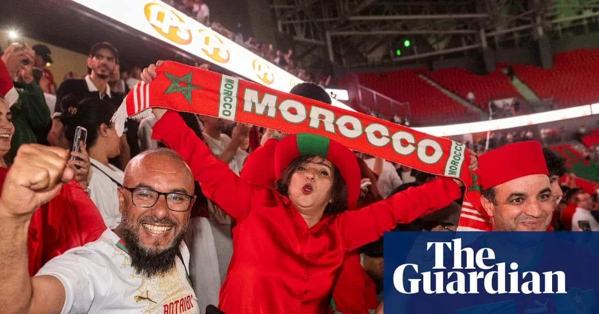 Fans celebrating with Moroccan scarves in stadium Fans celebrating with Moroccan scarves in stadium