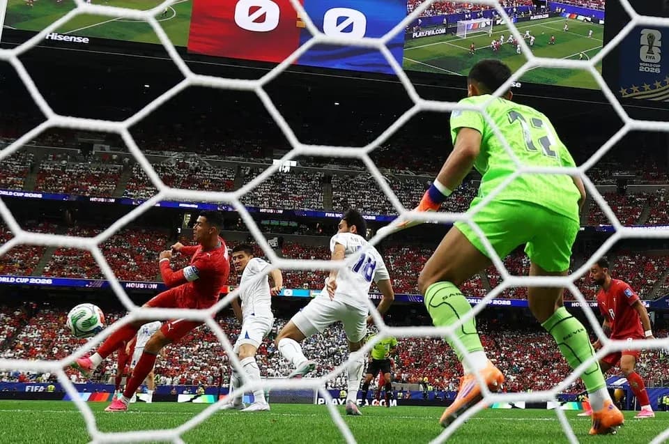 Goalkeeper diving to save a shot during match Goalkeeper diving to save a shot during match