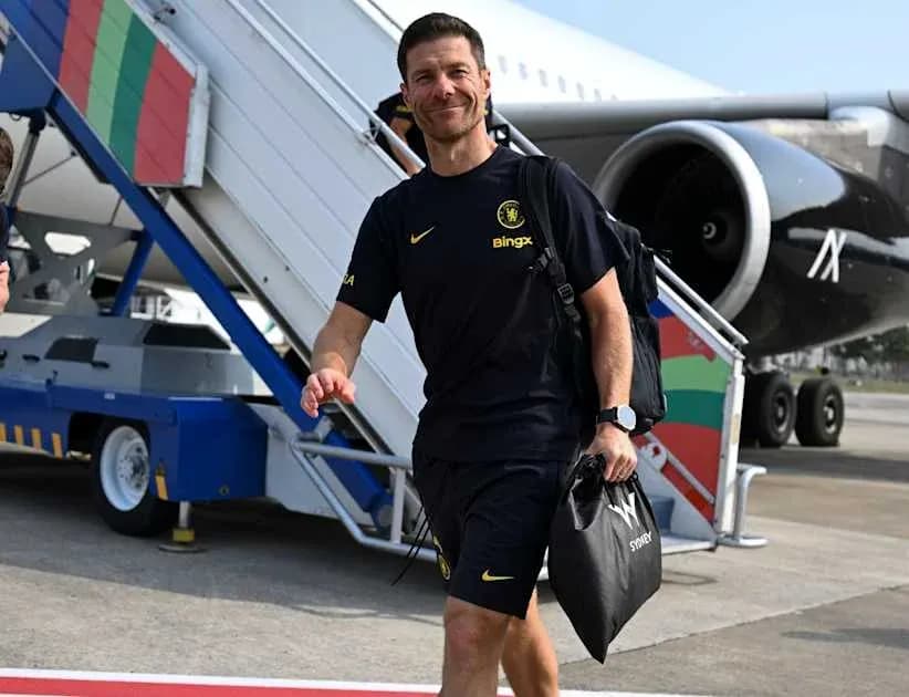 Football coach arriving at airport with luggage Football coach arriving at airport with luggage