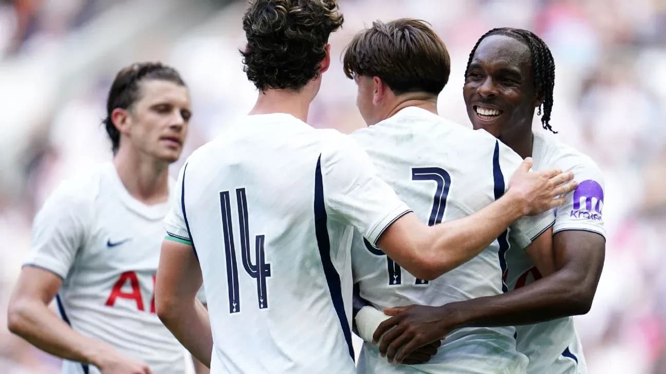 Tottenham players celebrating a goal together Tottenham players celebrating a goal together