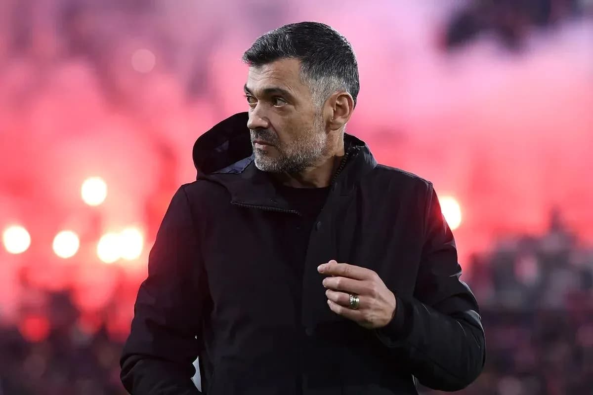 Men coach on sideline with smoke in background Men coach on sideline with smoke in background