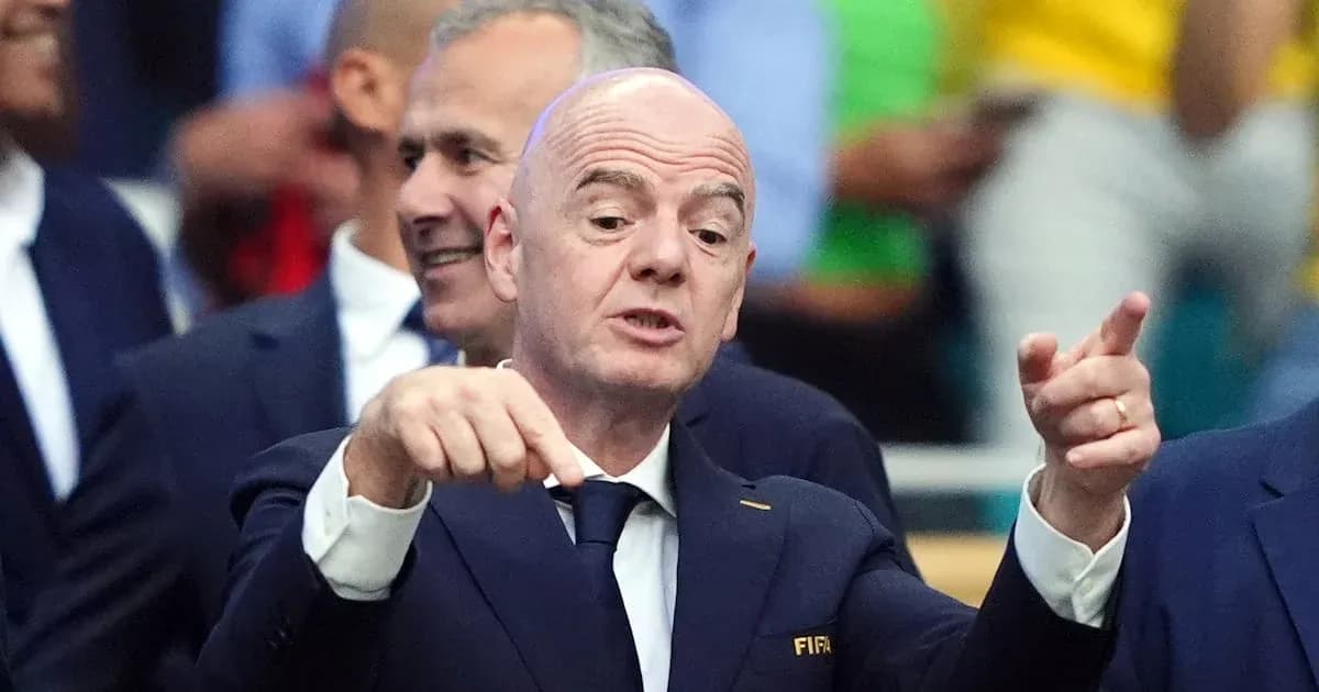 FIFA president gesturing during event with officials FIFA president gesturing during event with officials
