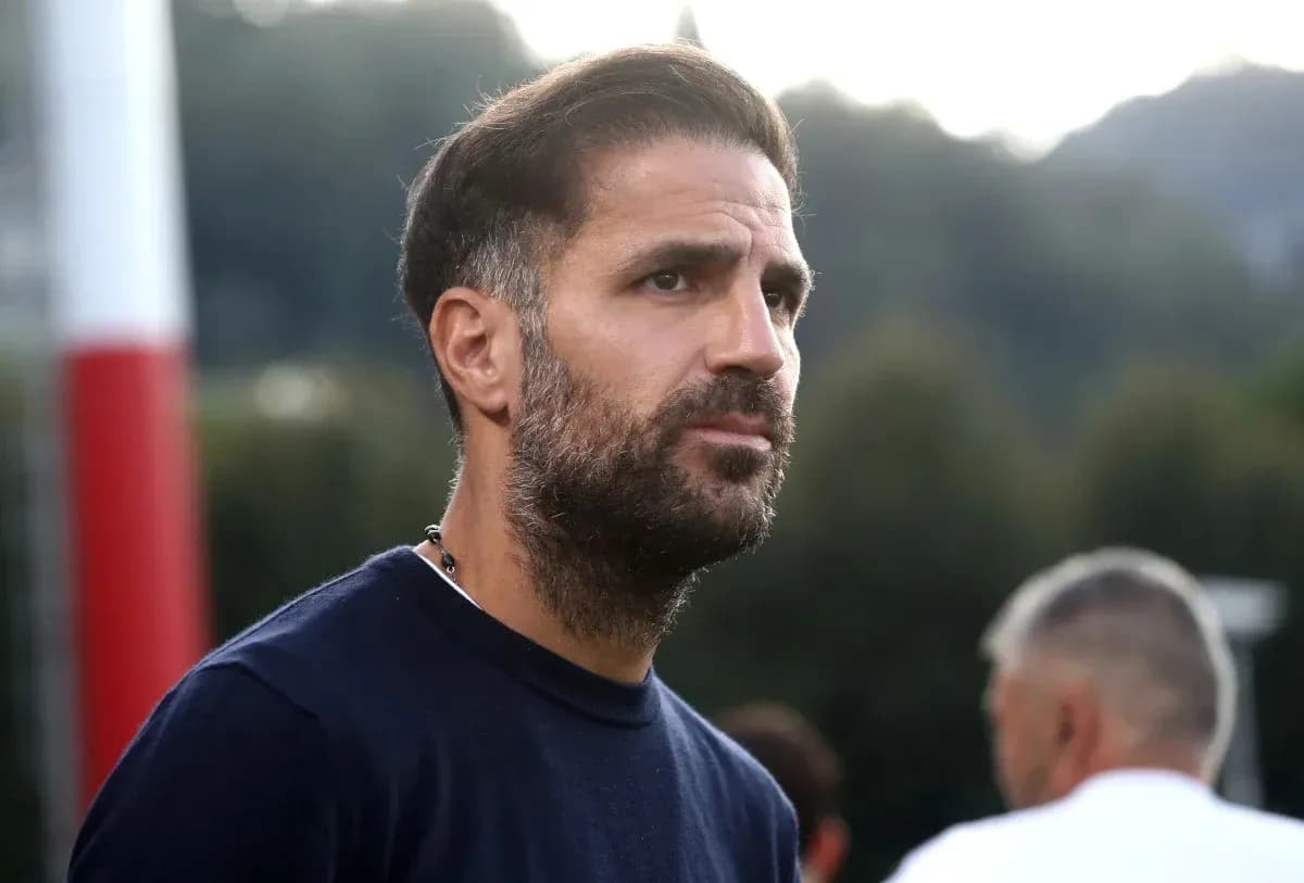 Football coach observing training session outdoors Football coach observing training session outdoors