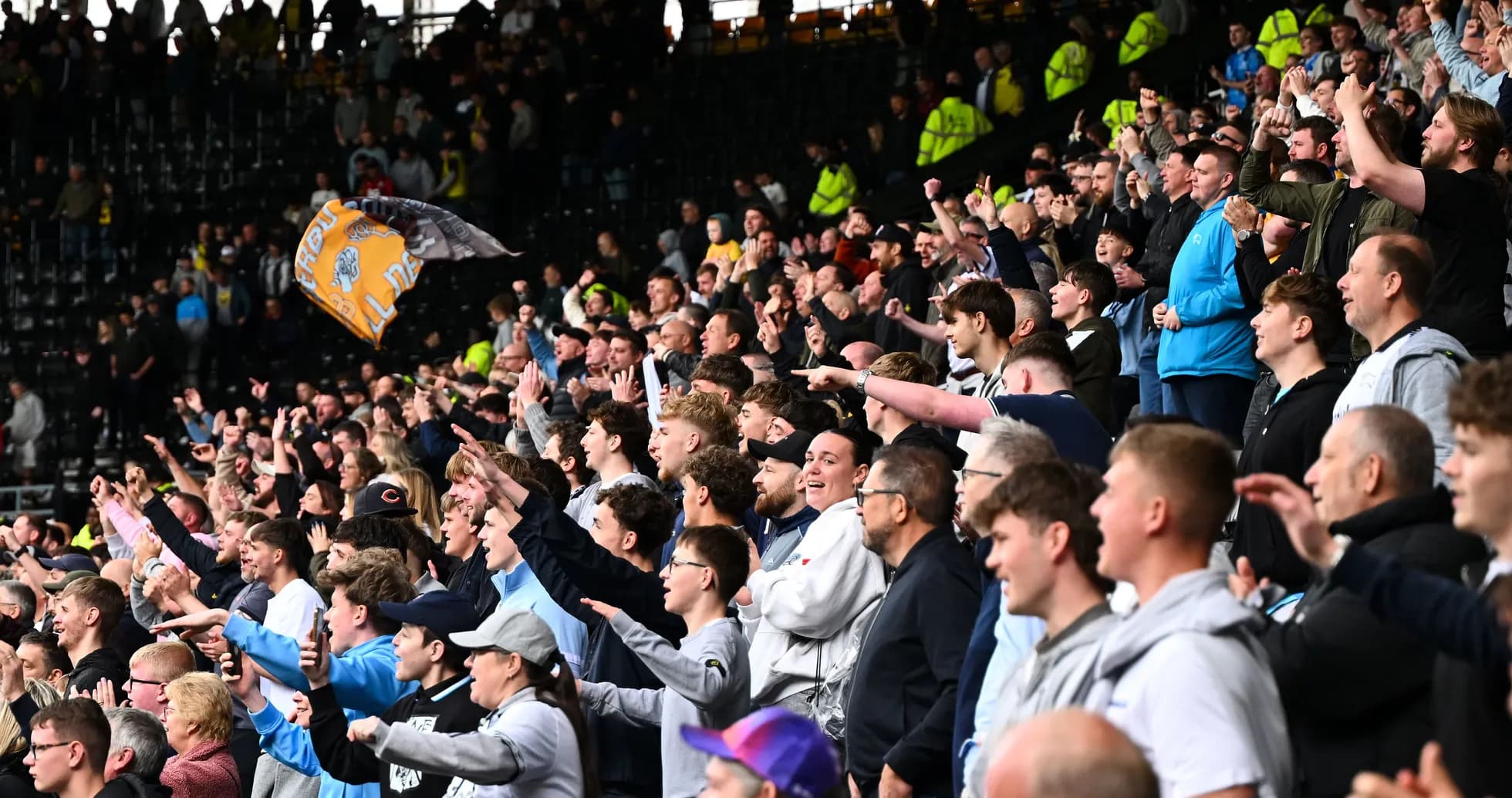 Jubilation of fans cheering in the stadium Jubilation of fans cheering in the stadium