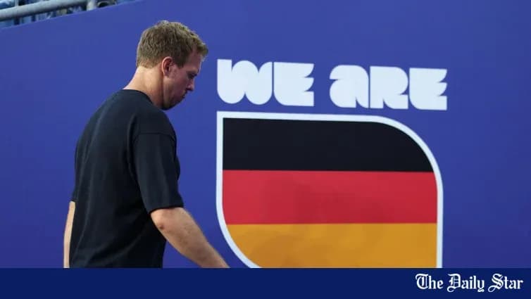 Tennis player walking past German flag display Tennis player walking past German flag display