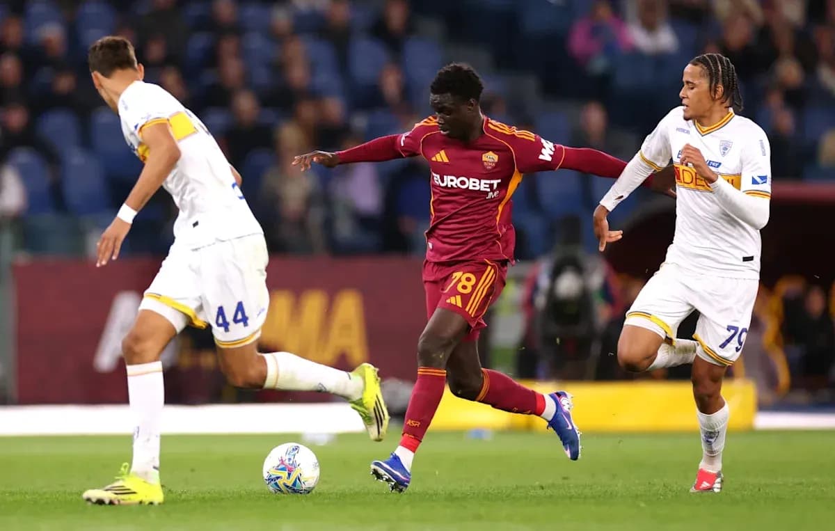 Roma player dribbling past two opponents during match Roma player dribbling past two opponents during match