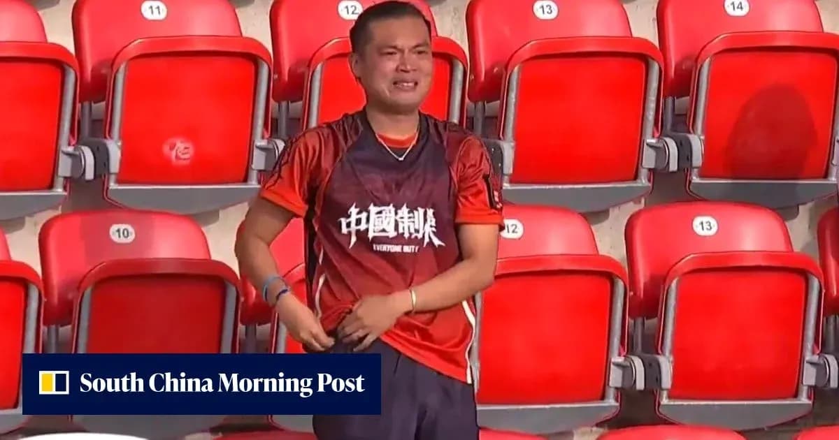 Fan wearing jersey in empty stadium seats Fan wearing jersey in empty stadium seats