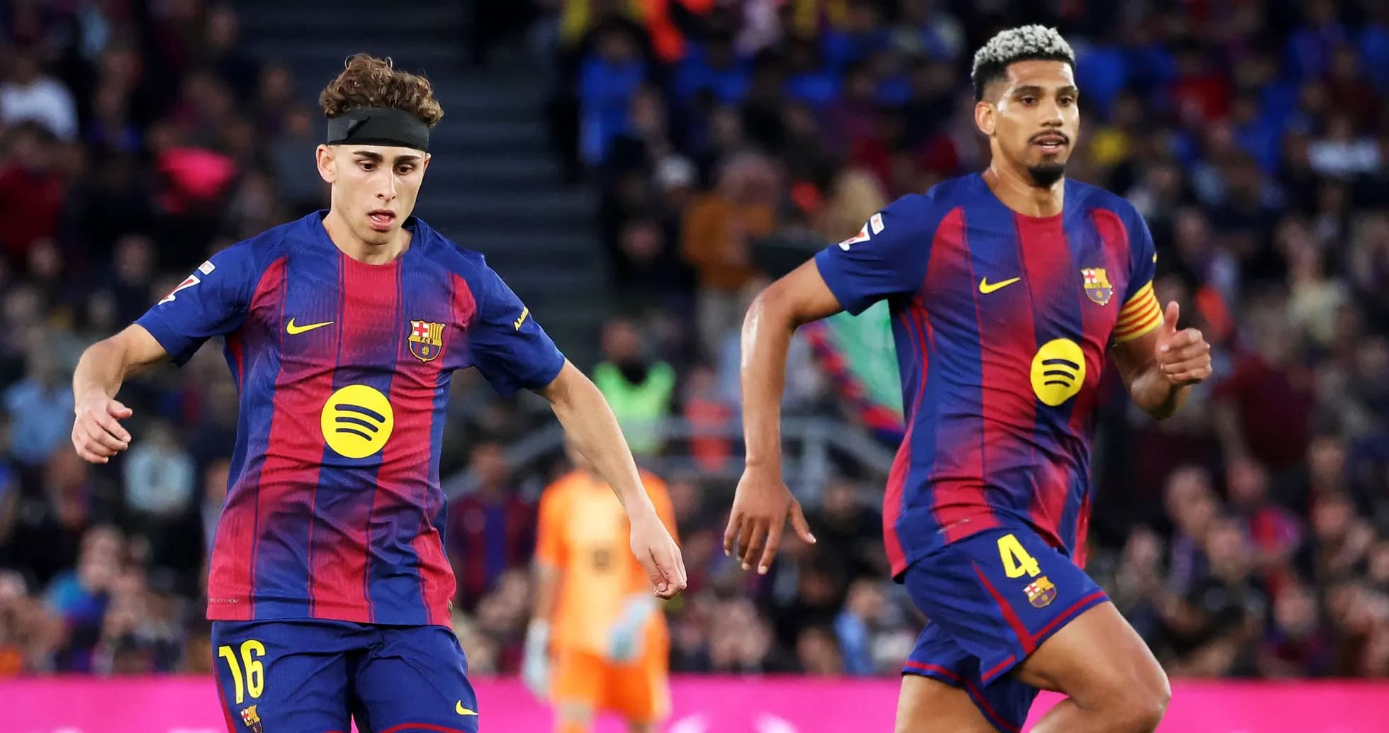 Barcelona players running during a match Barcelona players running during a match