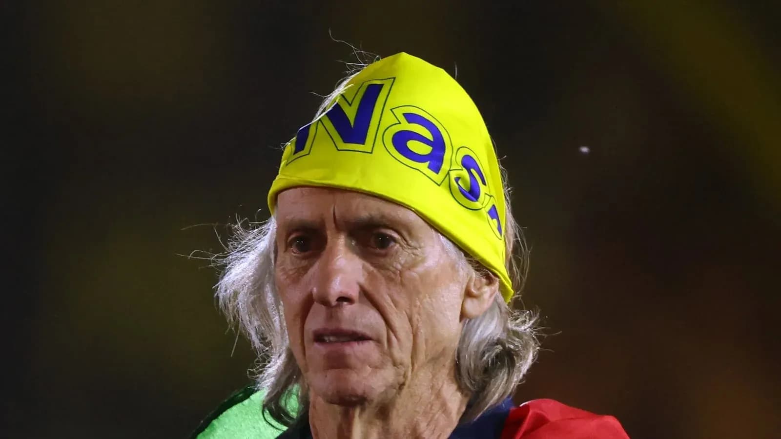 Older man wearing a bright yellow headband Older man wearing a bright yellow headband