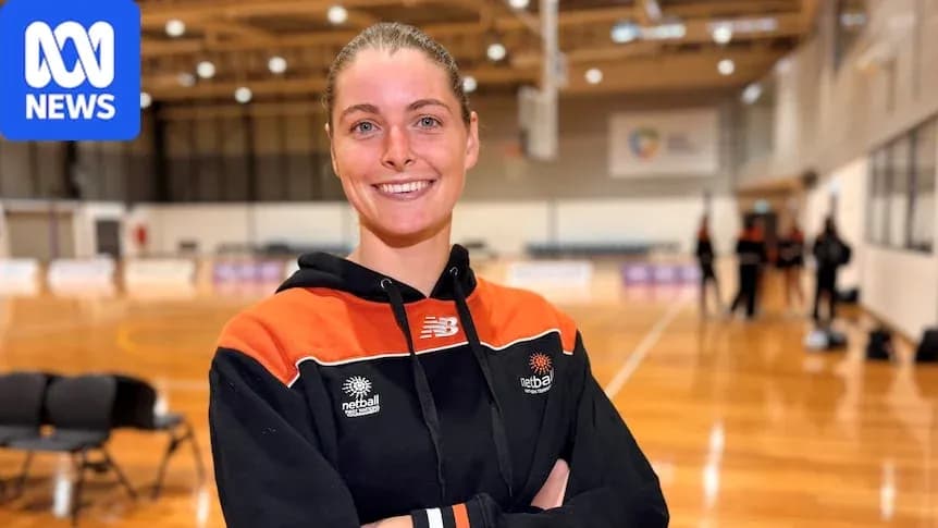 Netball player posing in training facility Netball player posing in training facility