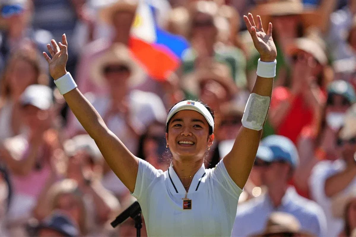 Tennis player celebrating in front of cheering crowd Tennis player celebrating in front of cheering crowd
