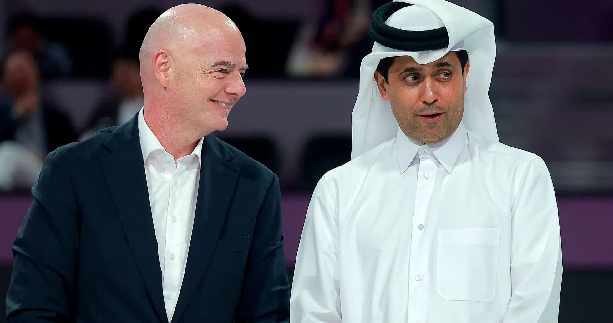 Two men conversing at an event in Qatar Two men conversing at an event in Qatar