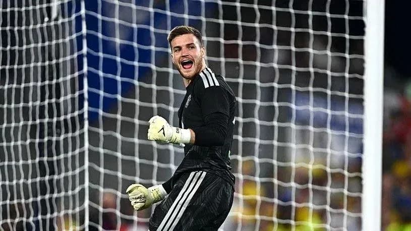 Goalkeeper celebrating after making a save Goalkeeper celebrating after making a save
