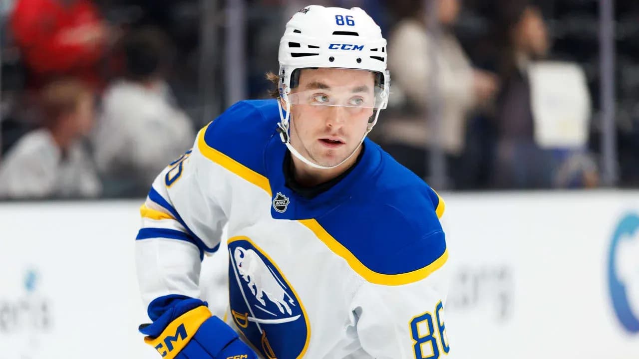 Hockey player in Buffalo Sabres uniform on ice Hockey player in Buffalo Sabres uniform on ice