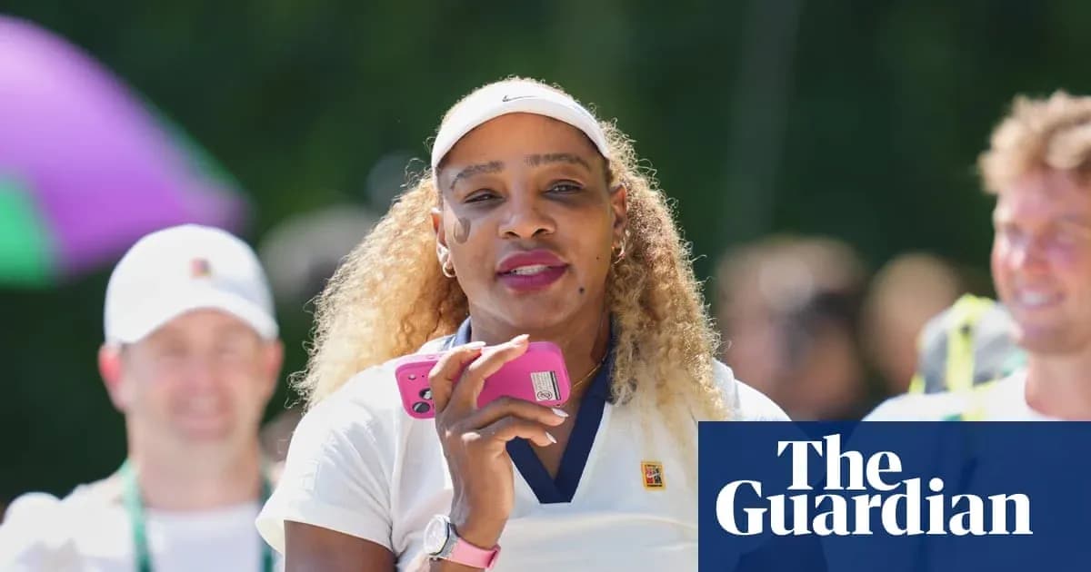 Tennis player holding phone during outdoor event Tennis player holding phone during outdoor event