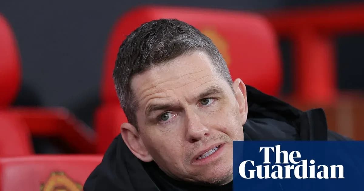 Coach sitting on bench during match at stadium Coach sitting on bench during match at stadium