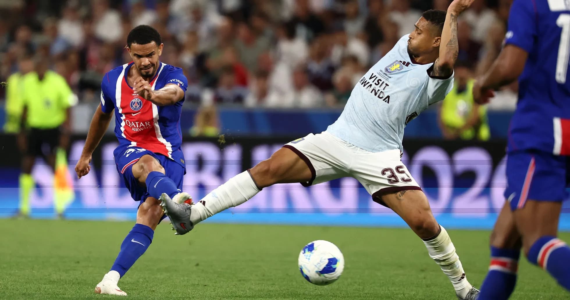 Player striking the ball during a football match Player striking the ball during a football match