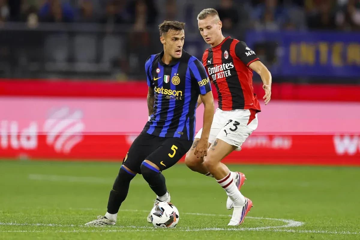 Inter and Milan players competing for the ball Inter and Milan players competing for the ball