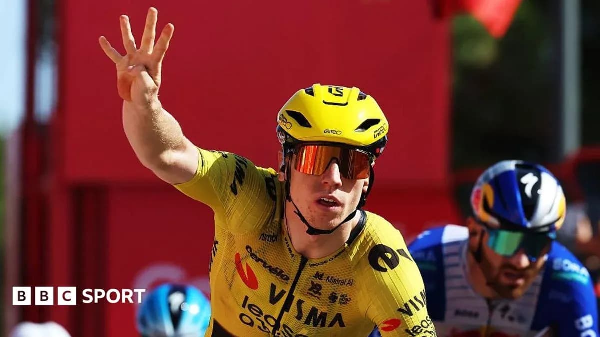 Bicycle racer in yellow jersey celebrating victory Bicycle racer in yellow jersey celebrating victory