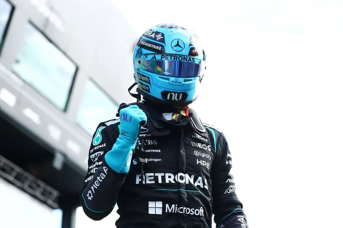 F1 driver celebrating in racing suit after victory F1 driver celebrating in racing suit after victory