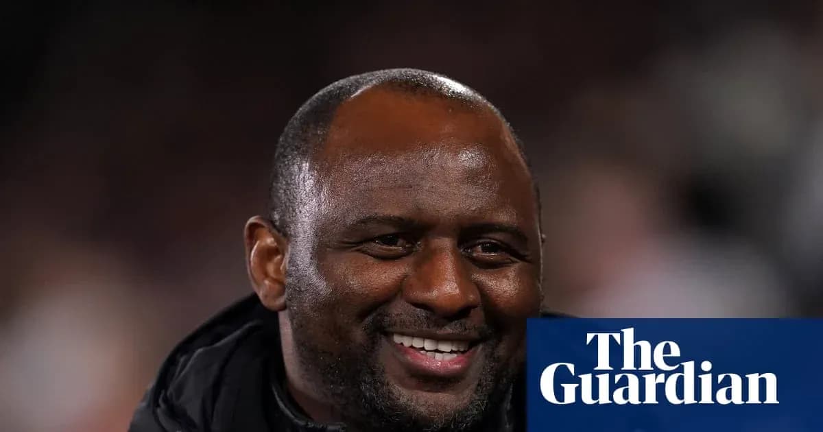 Men's football coach smiling during match Men's football coach smiling during match