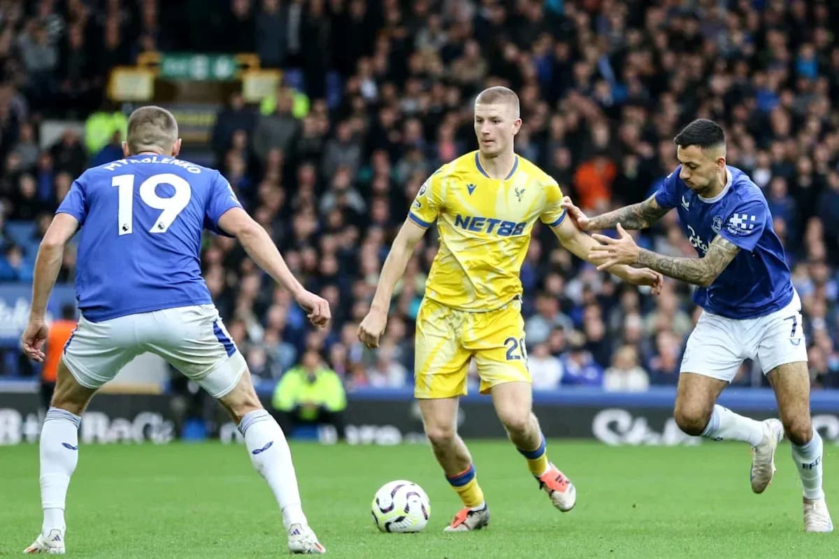 Two players contesting the ball during a match Two players contesting the ball during a match