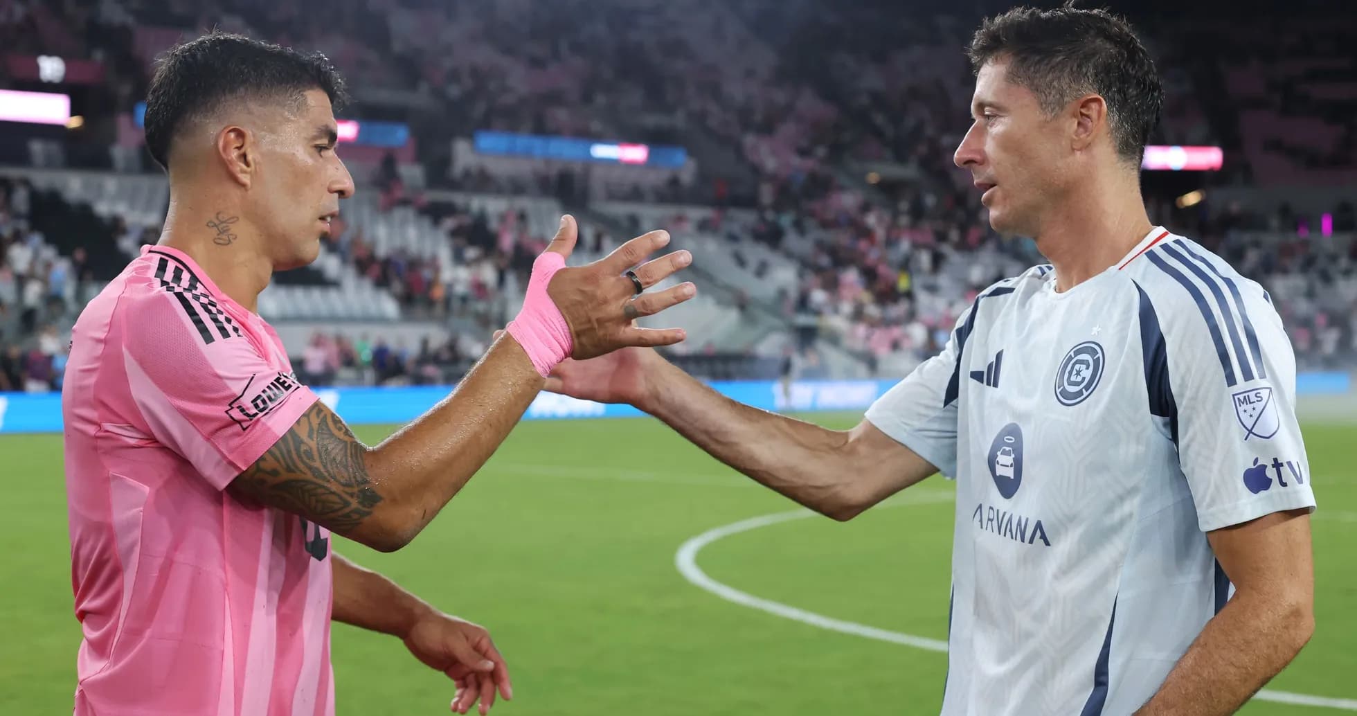 Two players shaking hands after the match Two players shaking hands after the match