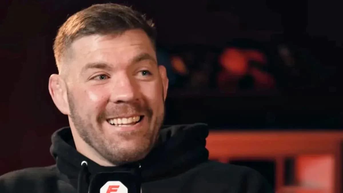 Man smiling during an interview with microphone Man smiling during an interview with microphone