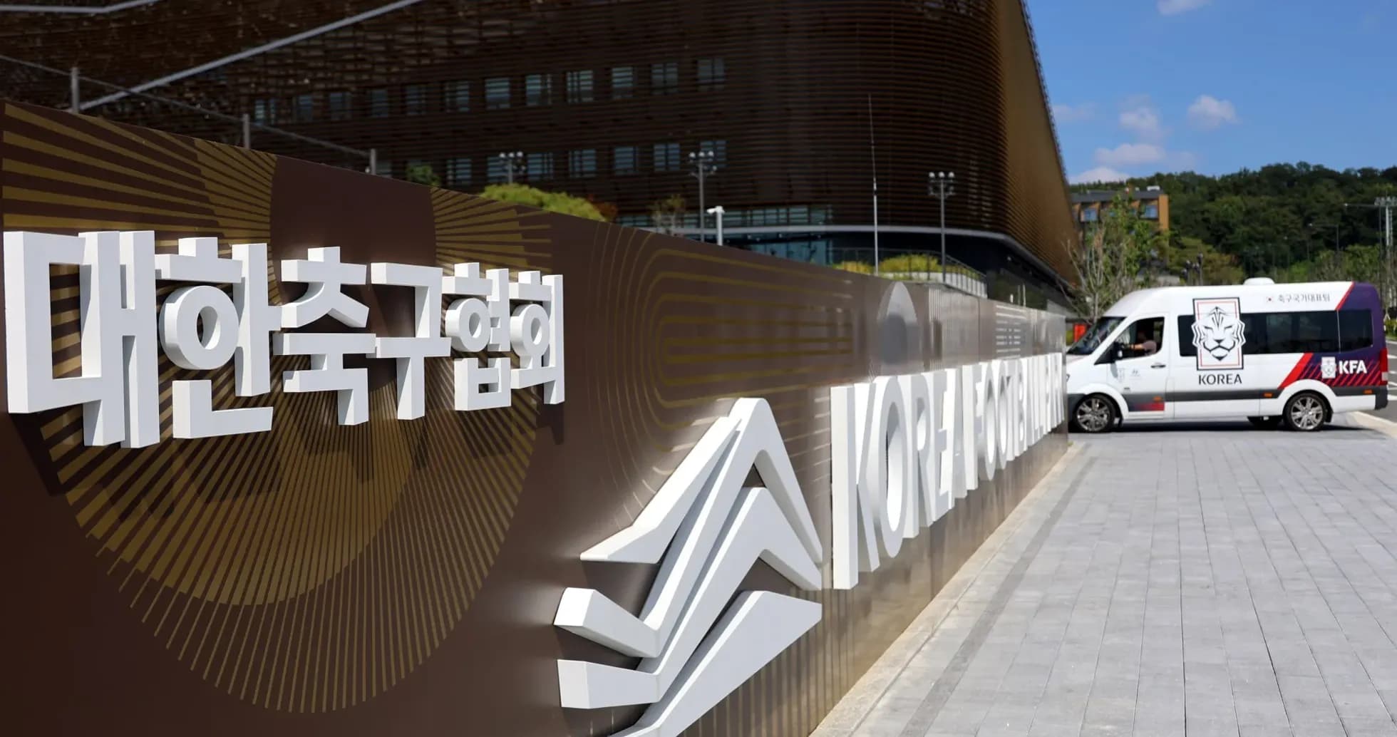 Korea Football Association sign with vehicle nearby Korea Football Association sign with vehicle nearby