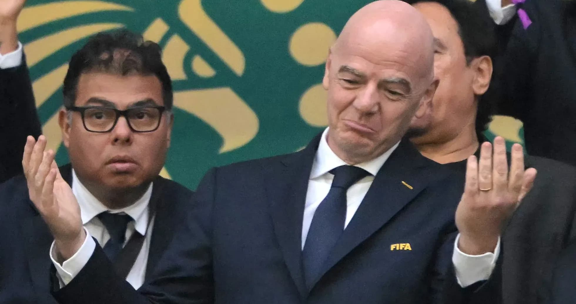 FIFA officials at an event with mixed expressions FIFA officials at an event with mixed expressions