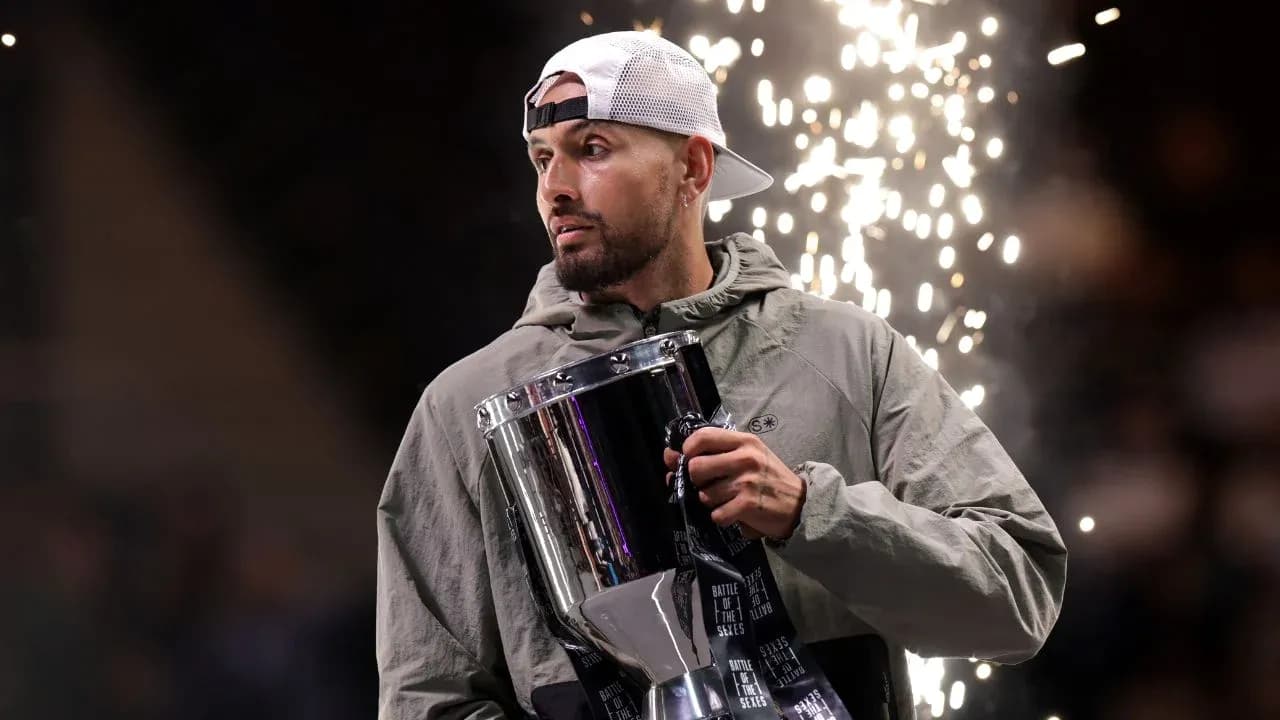 Athlete holding trophy with fireworks in background Athlete holding trophy with fireworks in background