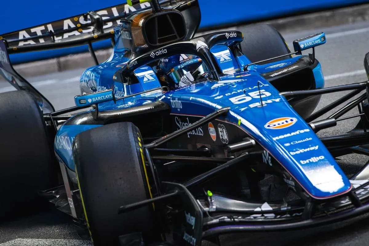 Formula 1 car on track during race Formula 1 car on track during race