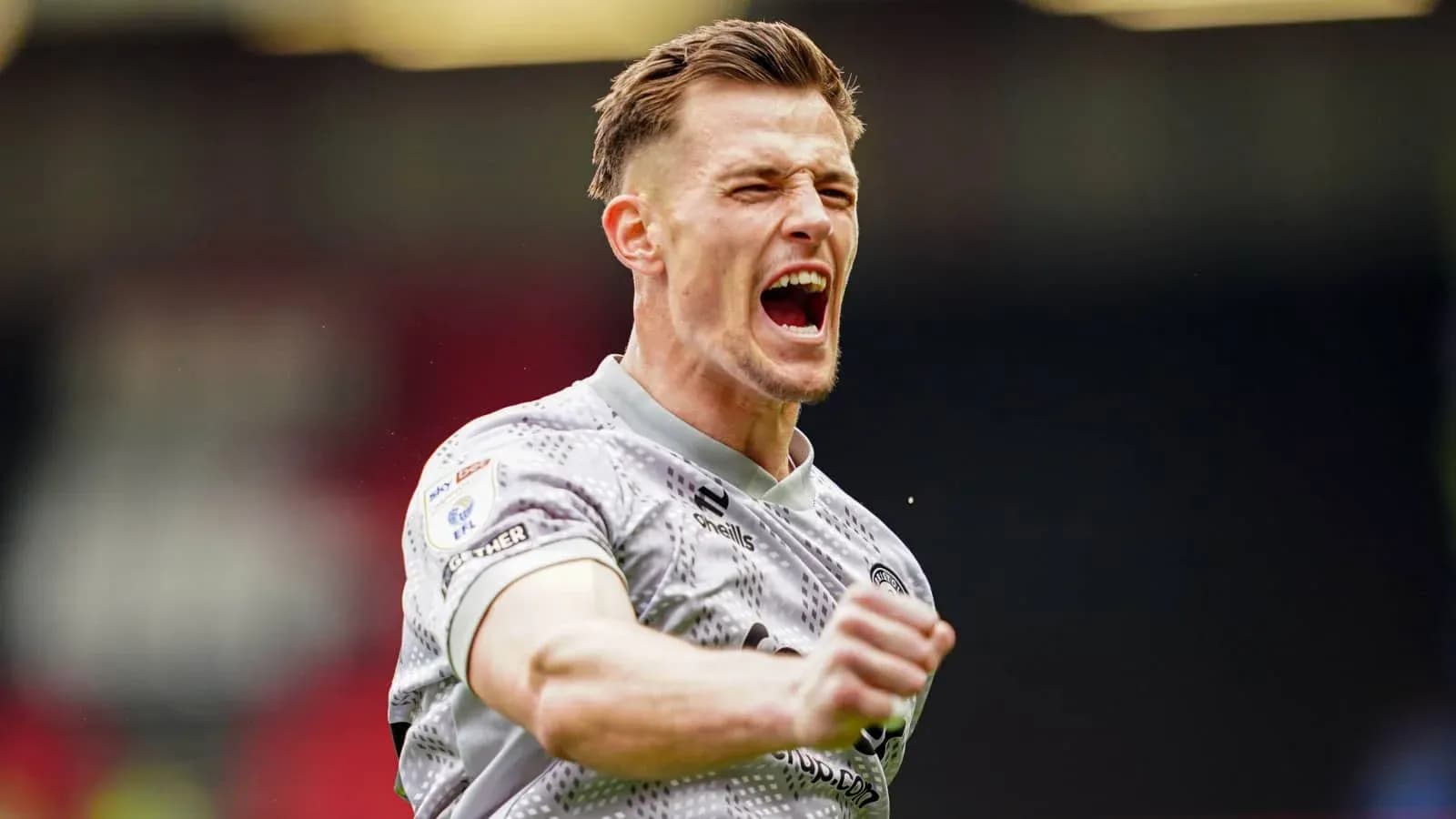 Player celebrating passionately after a successful play Player celebrating passionately after a successful play
