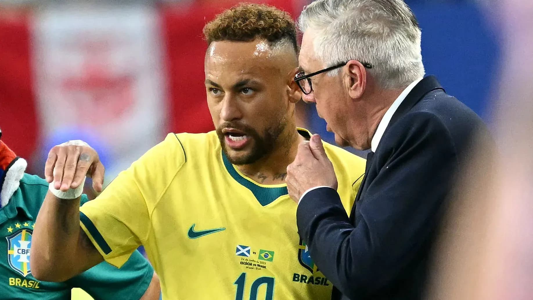 Neymar discussing strategy with coach during match Neymar discussing strategy with coach during match