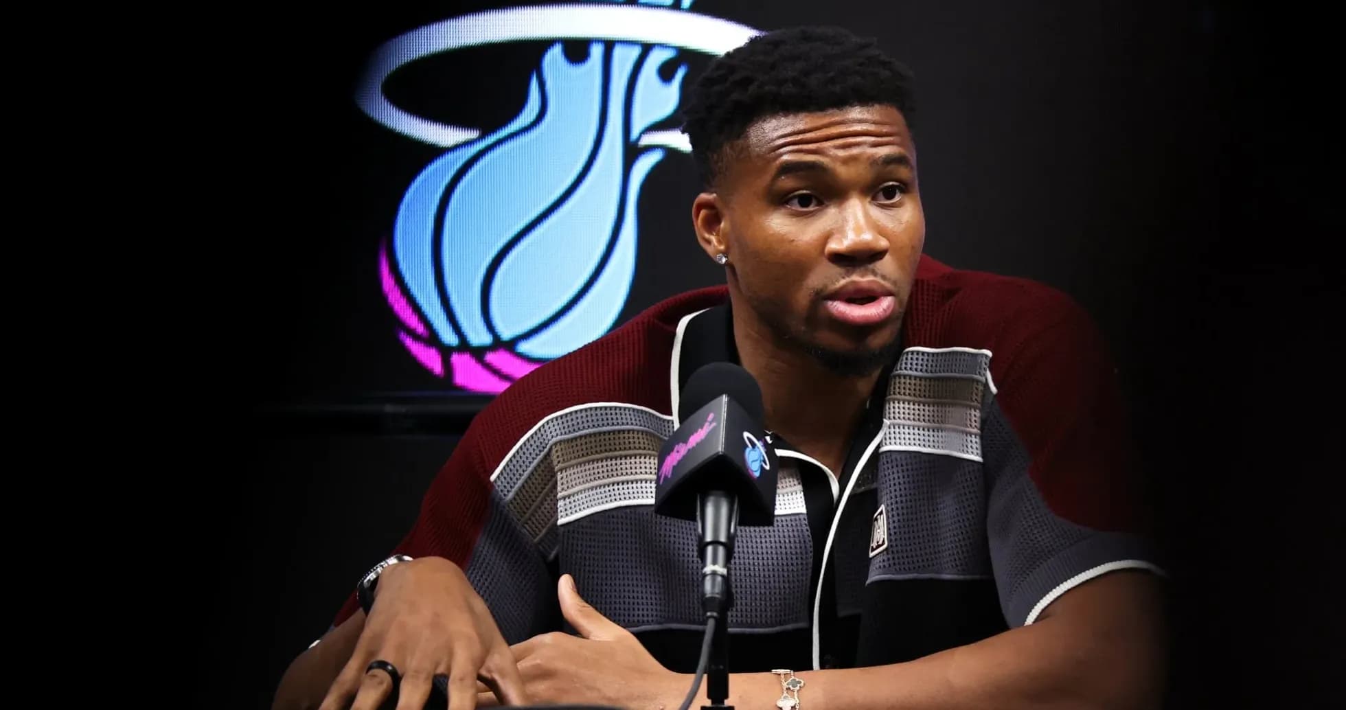 Basketball player speaking at press conference podium Basketball player speaking at press conference podium