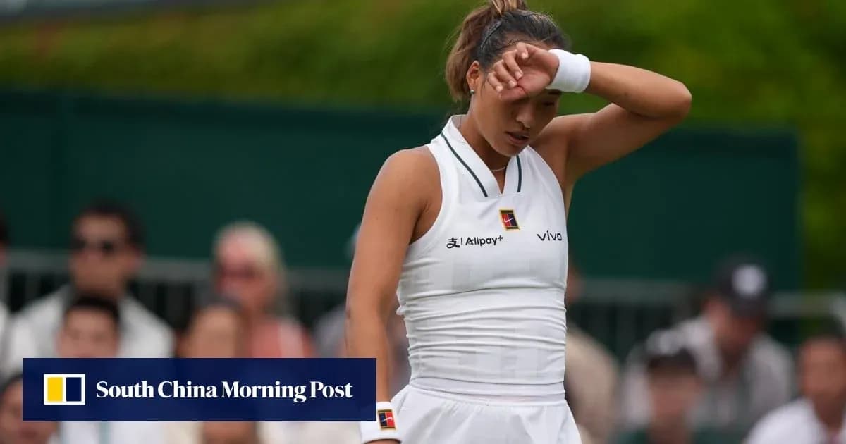 Tennis player wiping forehead during match Tennis player wiping forehead during match