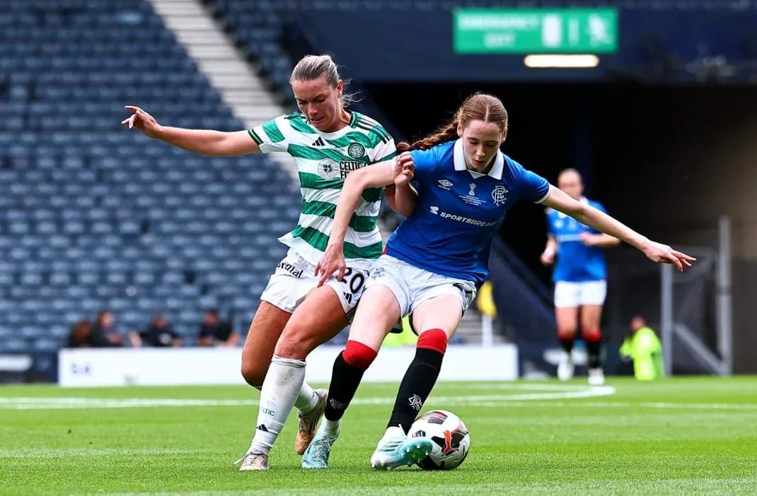 Celtic and Rangers players competing for the ball Celtic and Rangers players competing for the ball