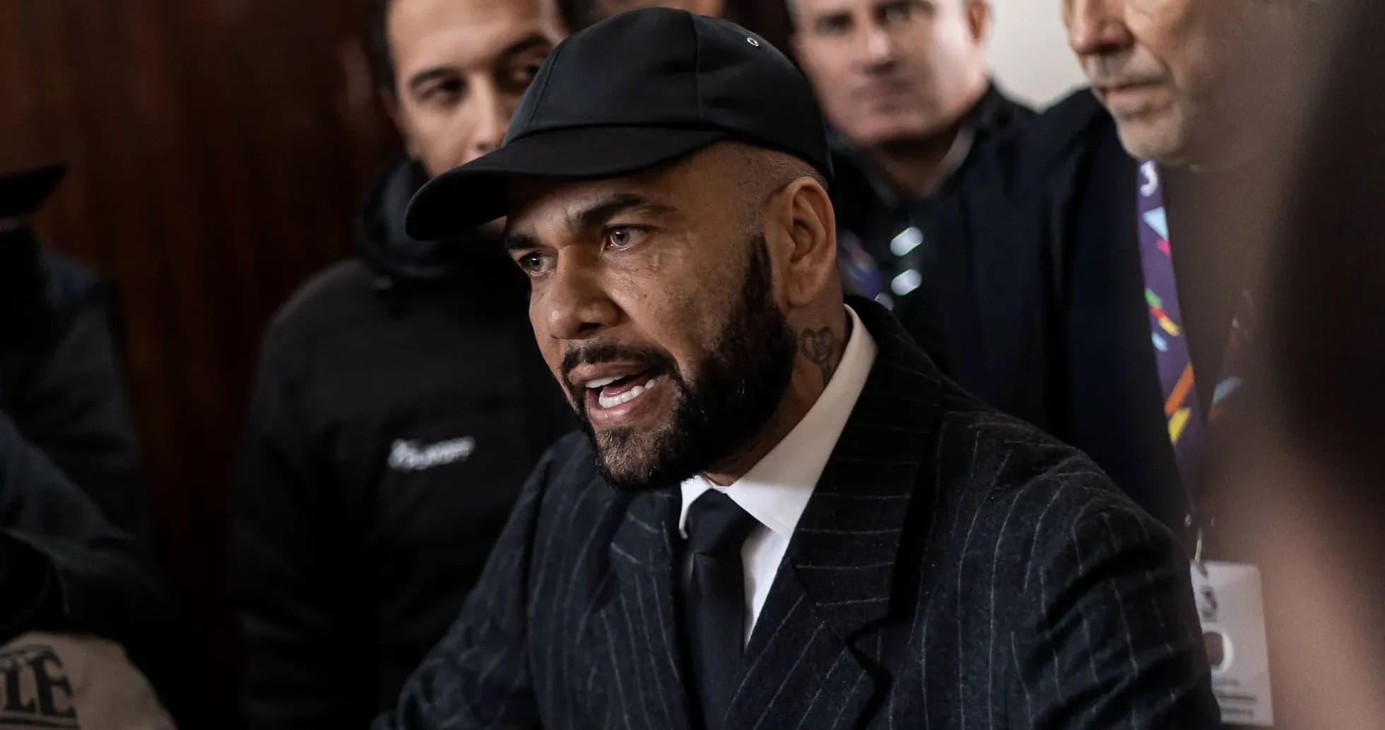 Dani Alves speaking surrounded by reporters and supporters Dani Alves speaking surrounded by reporters and supporters